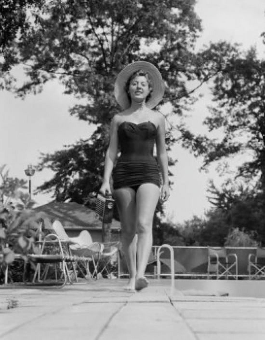 Young woman in swimwear walking Canvas Art - (24 x 36)