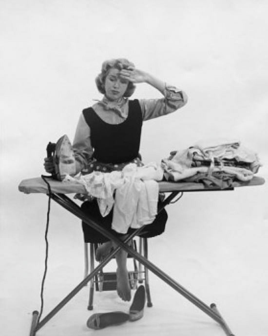 Young woman ironing on clothes Canvas Art - (24 x 36)