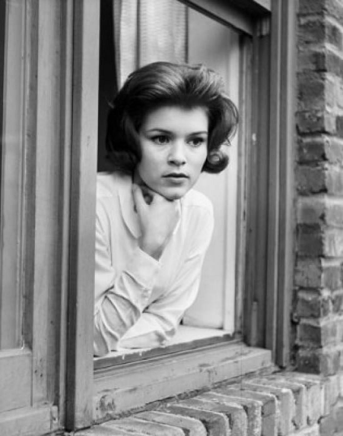Young woman leaning on window sill Canvas Art - (24 x 36)