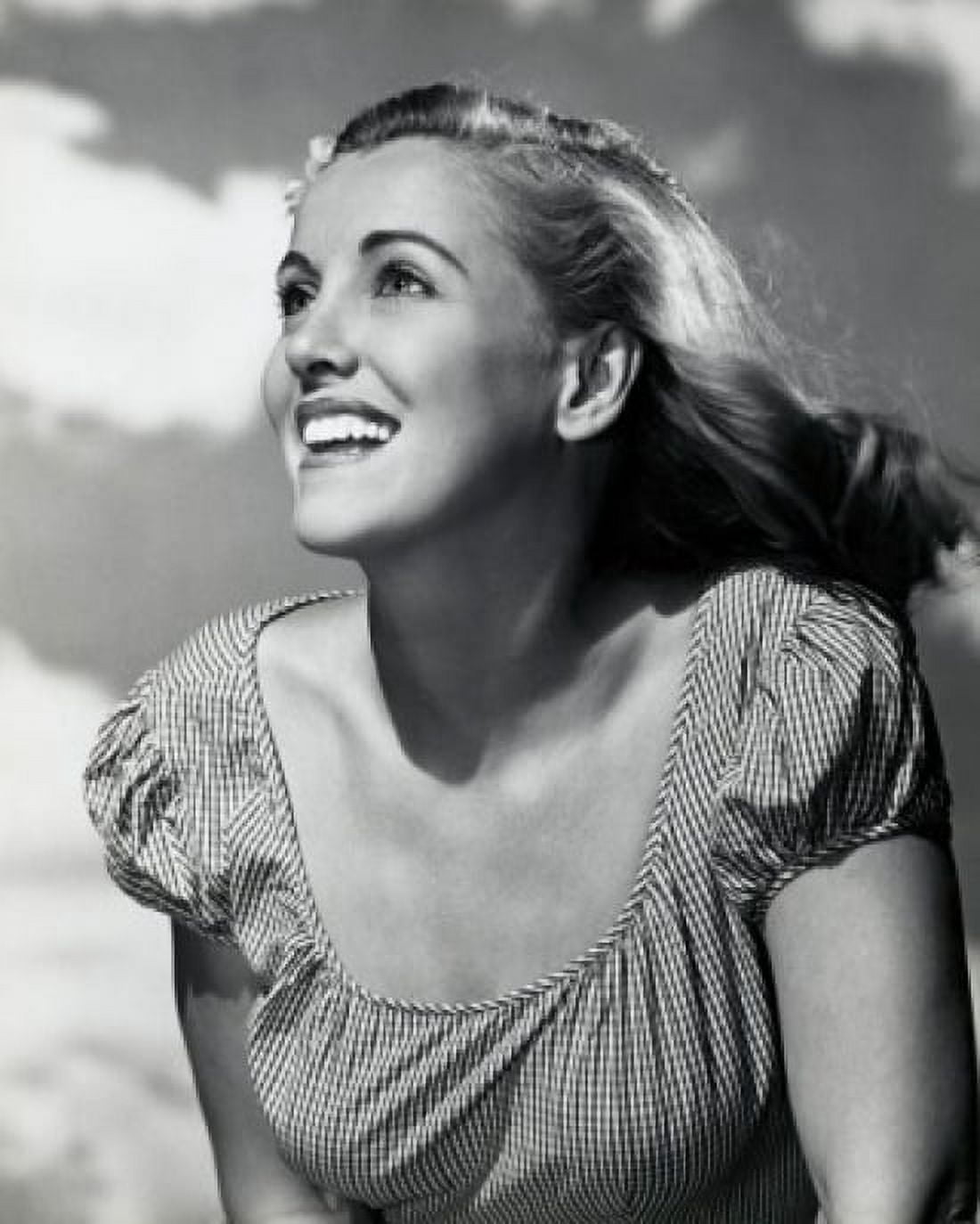 Young woman looking up and smiling Canvas Art - (24 x 36)
