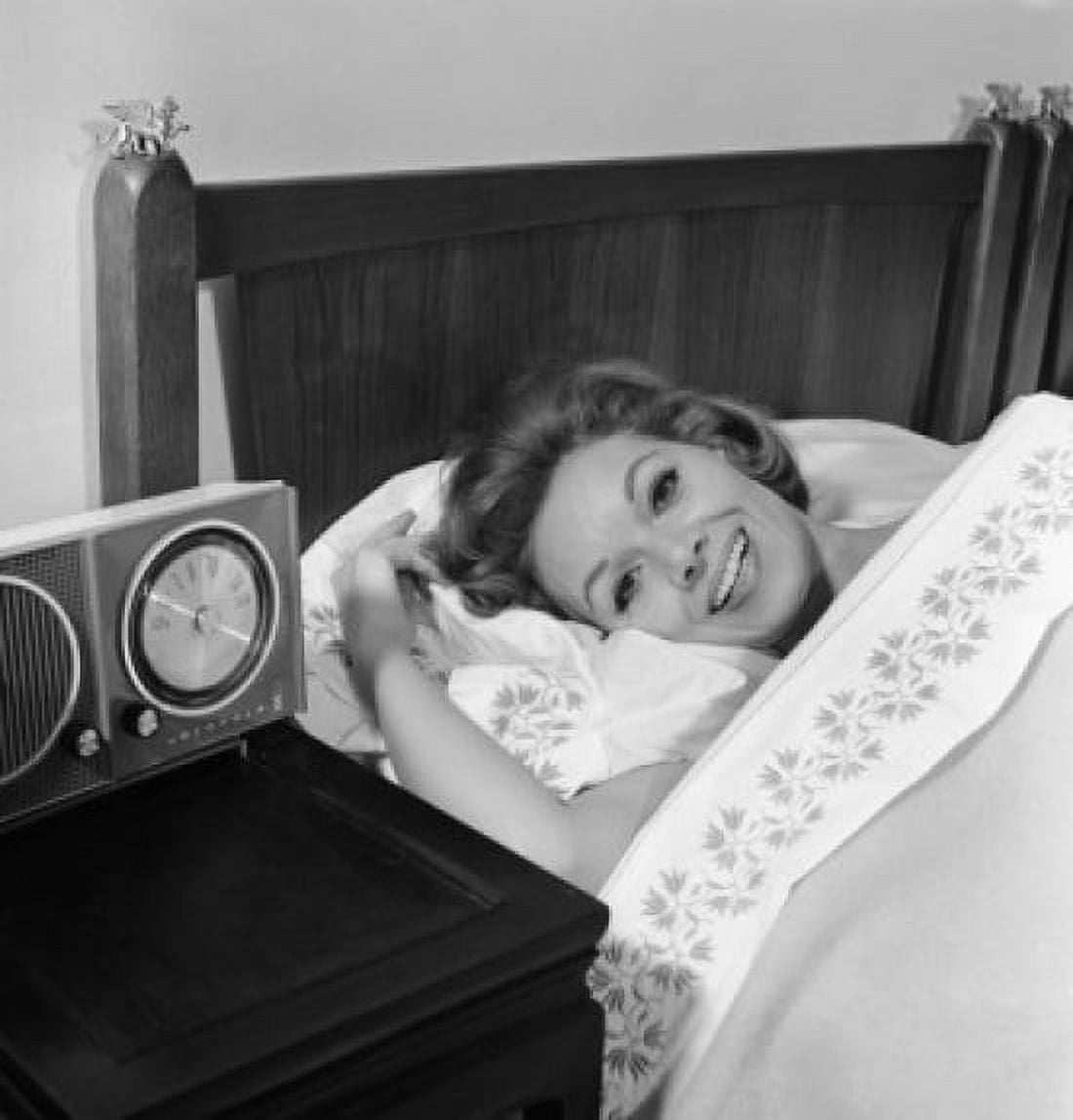Young woman lying in bed smiling Canvas Art - (24 x 36)