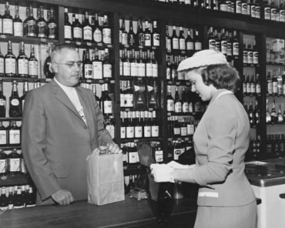 Young woman making a purchase at a liquor store Canvas Art - (24 x 36)