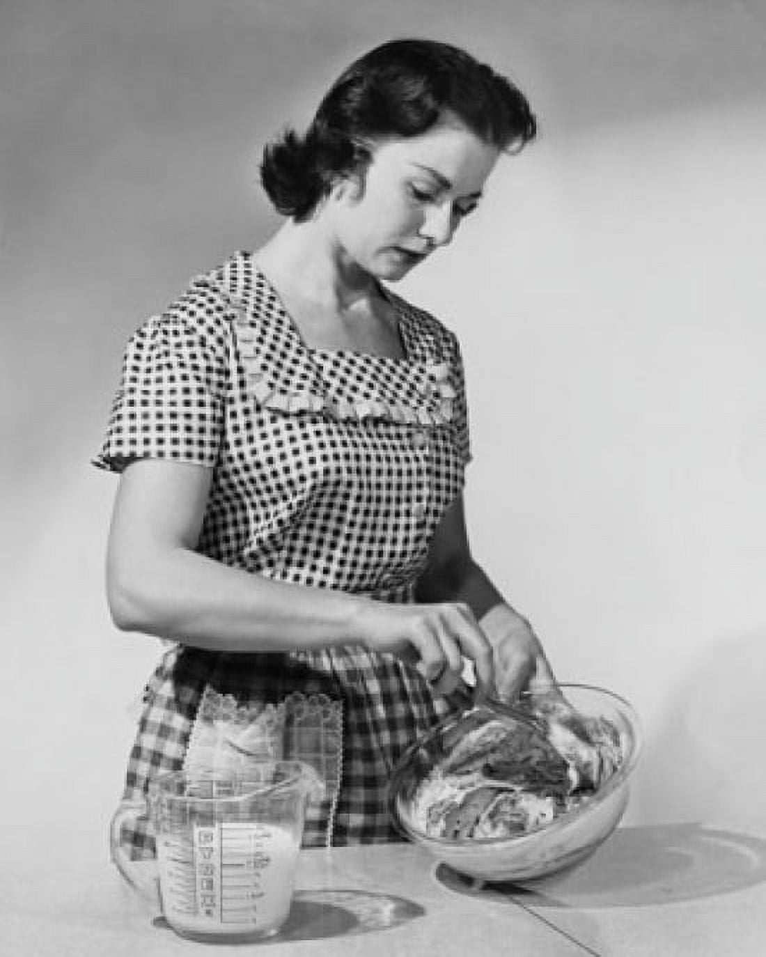 Young woman mixing ingredients in a bowl Canvas Art - (18 x 24)