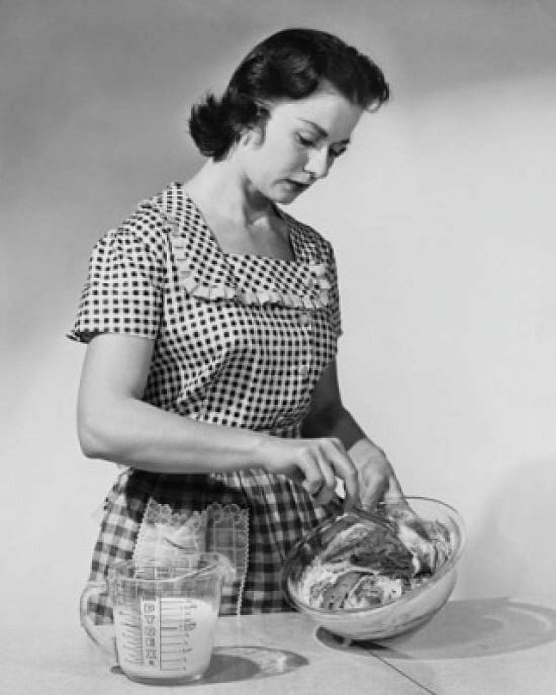 Young woman mixing ingredients in a bowl Canvas Art - (24 x 36)