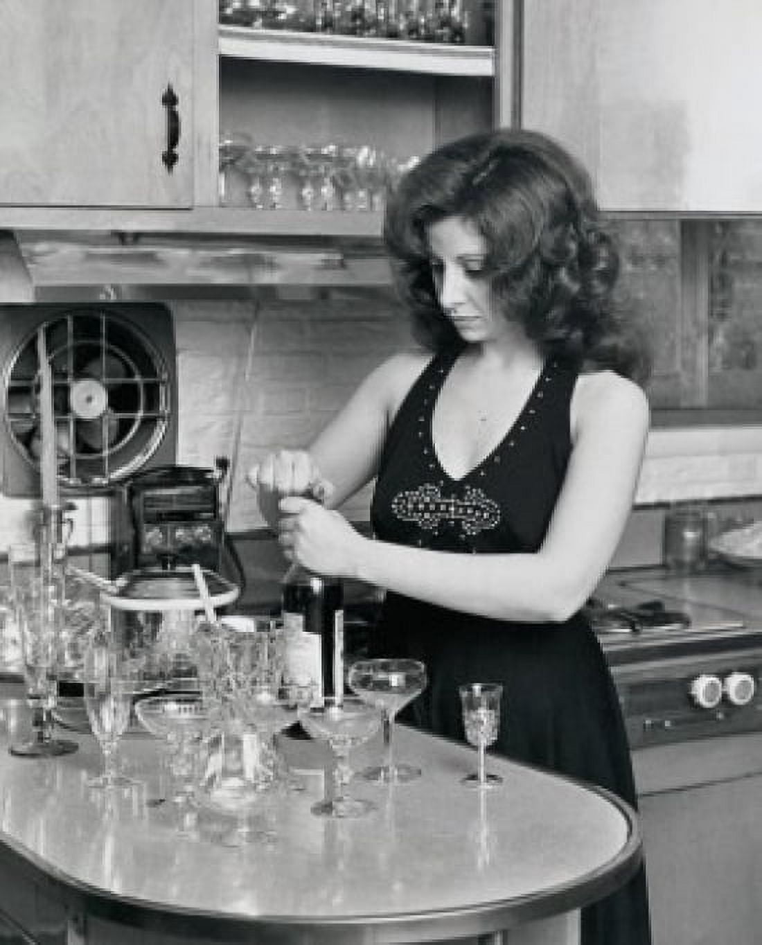 Young woman opening a wine bottle Canvas Art - (24 x 36)