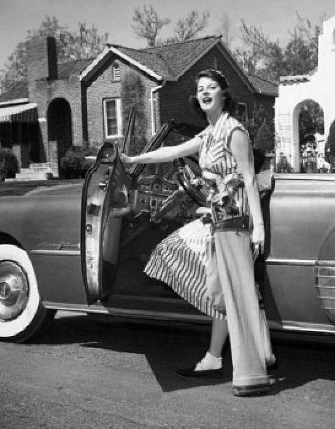 Young woman opening the door of a car Canvas Art - (18 x 24)