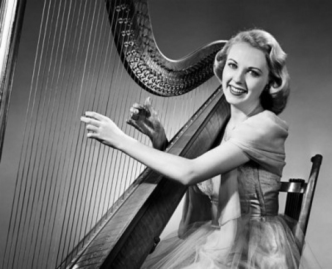 Young woman playing a harp and smiling Canvas Art - (24 x 36)