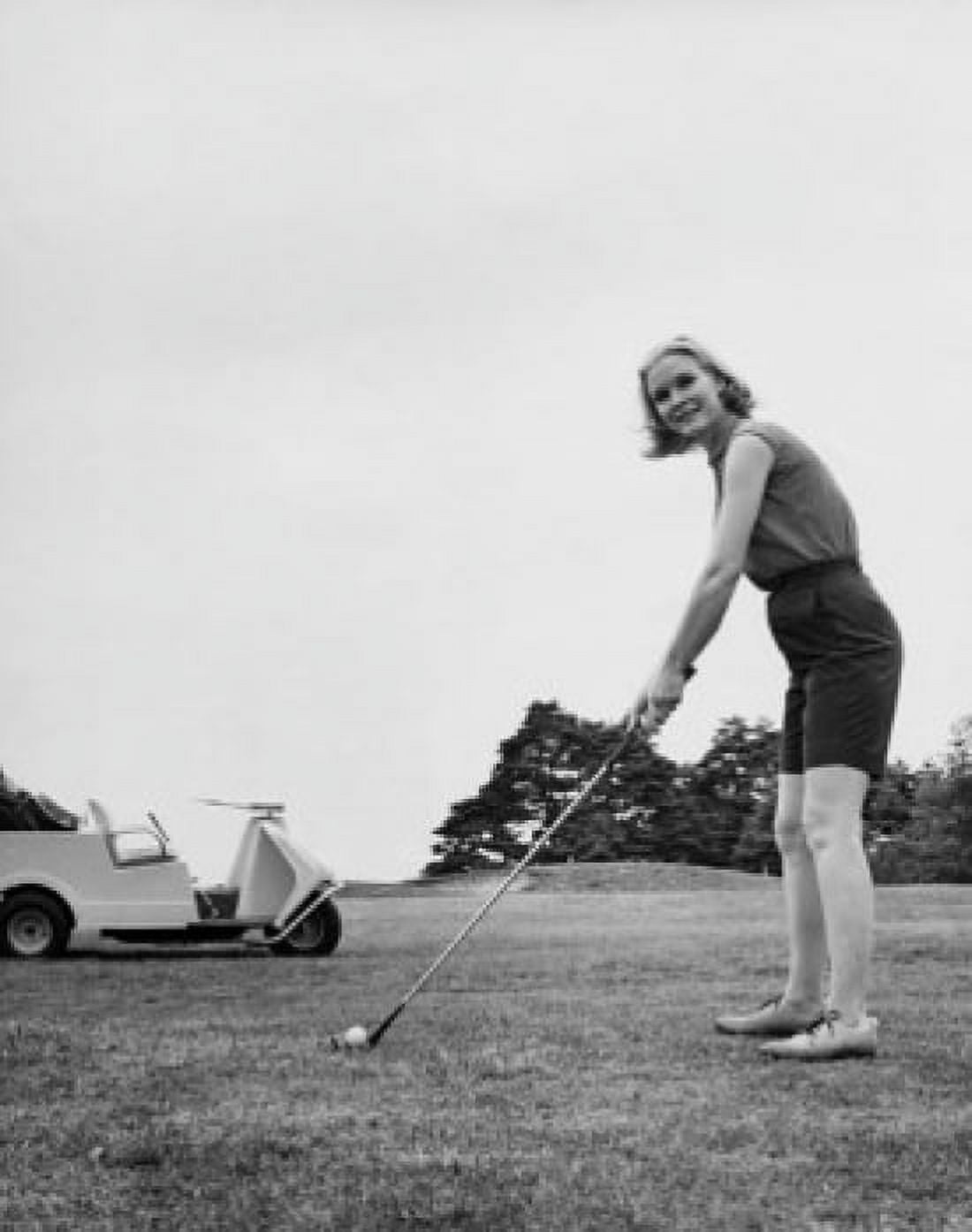Young woman playing golf on a golf course Canvas Art - (18 x 24)