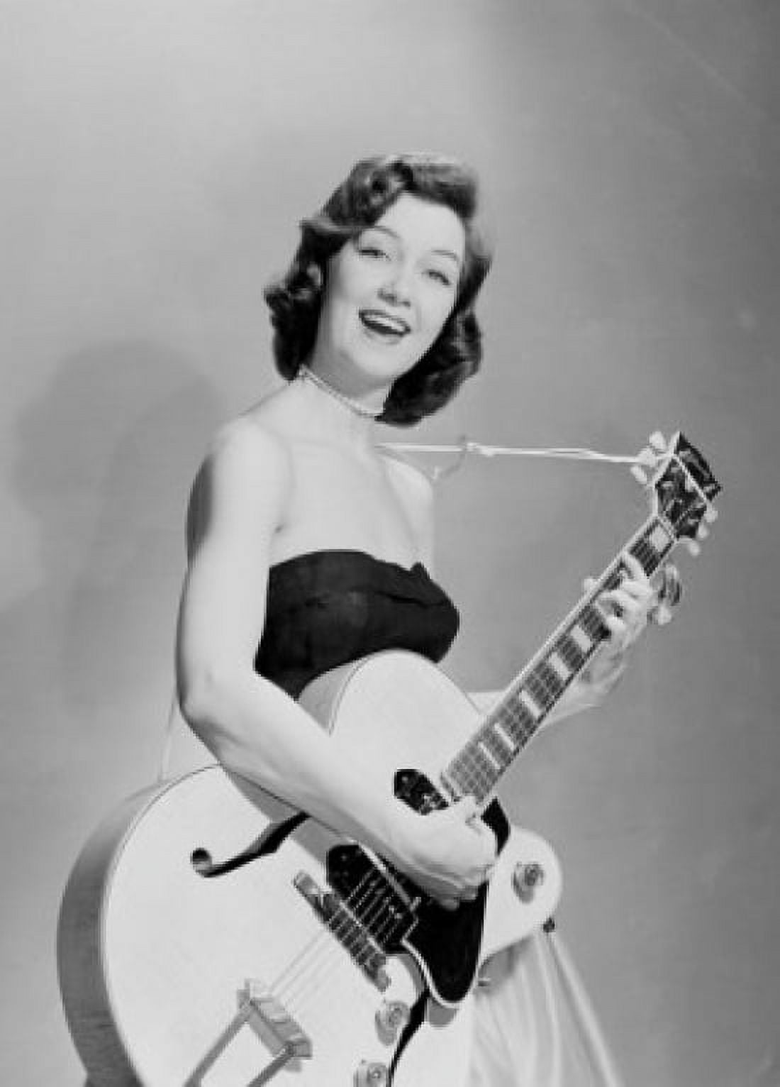 Young woman playing guitar Canvas Art - (18 x 24)