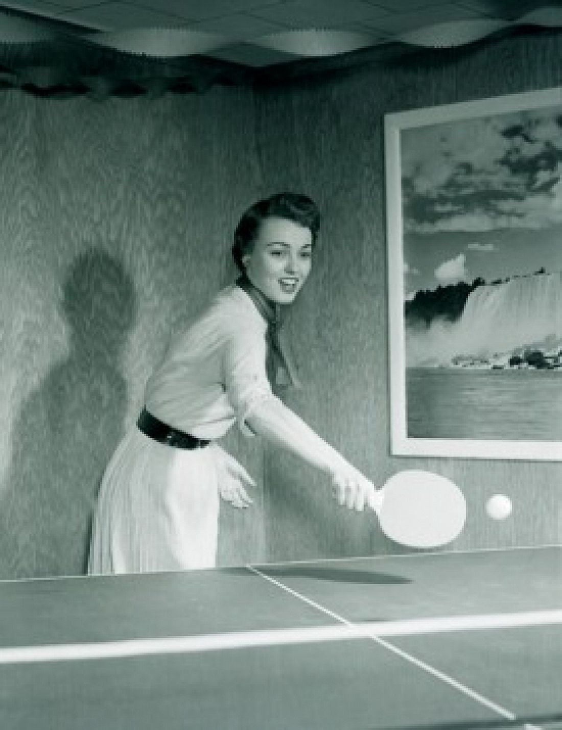 Young woman playing table tennis in home Canvas Art - (24 x 36)