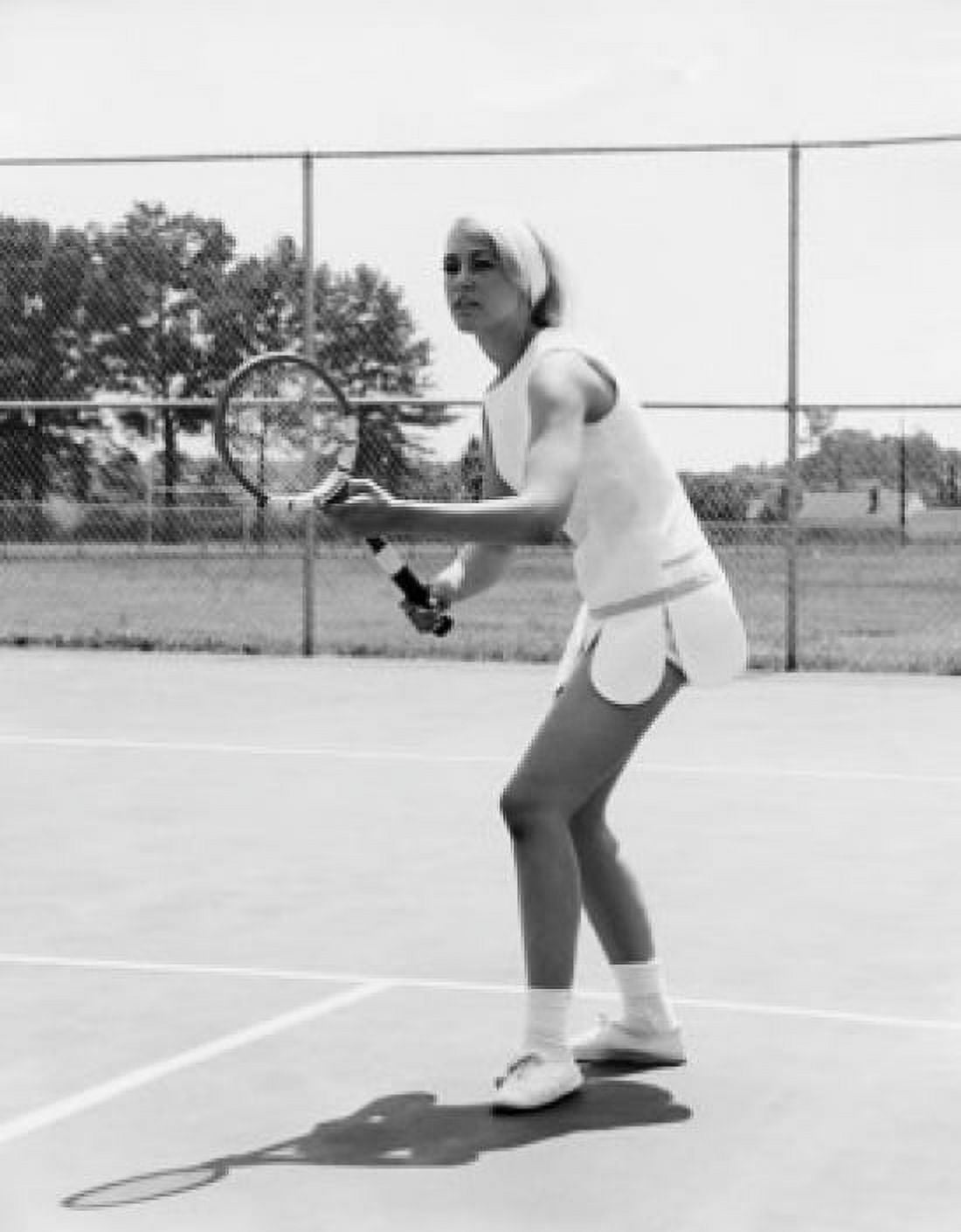 Young woman playing tennis on a tennis court Canvas Art - (18 x 24)