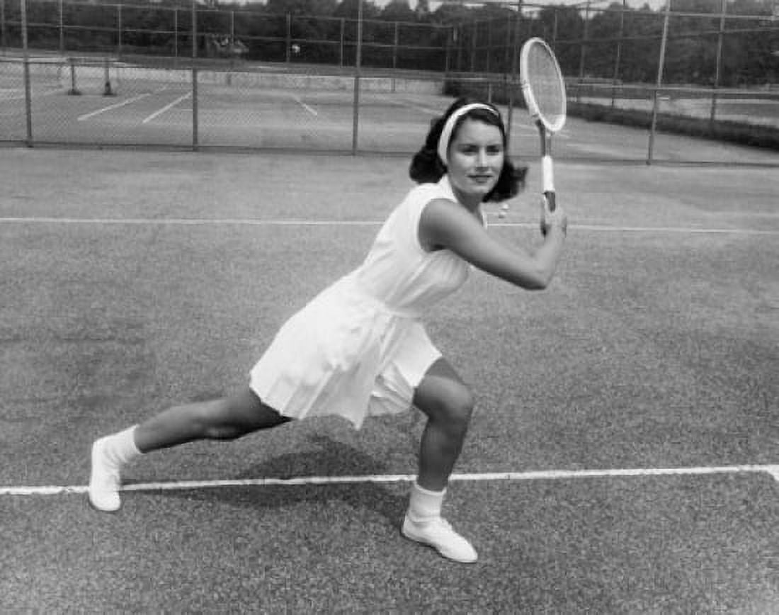 Young woman playing tennis on a tennis court Canvas Art - (18 x 24)