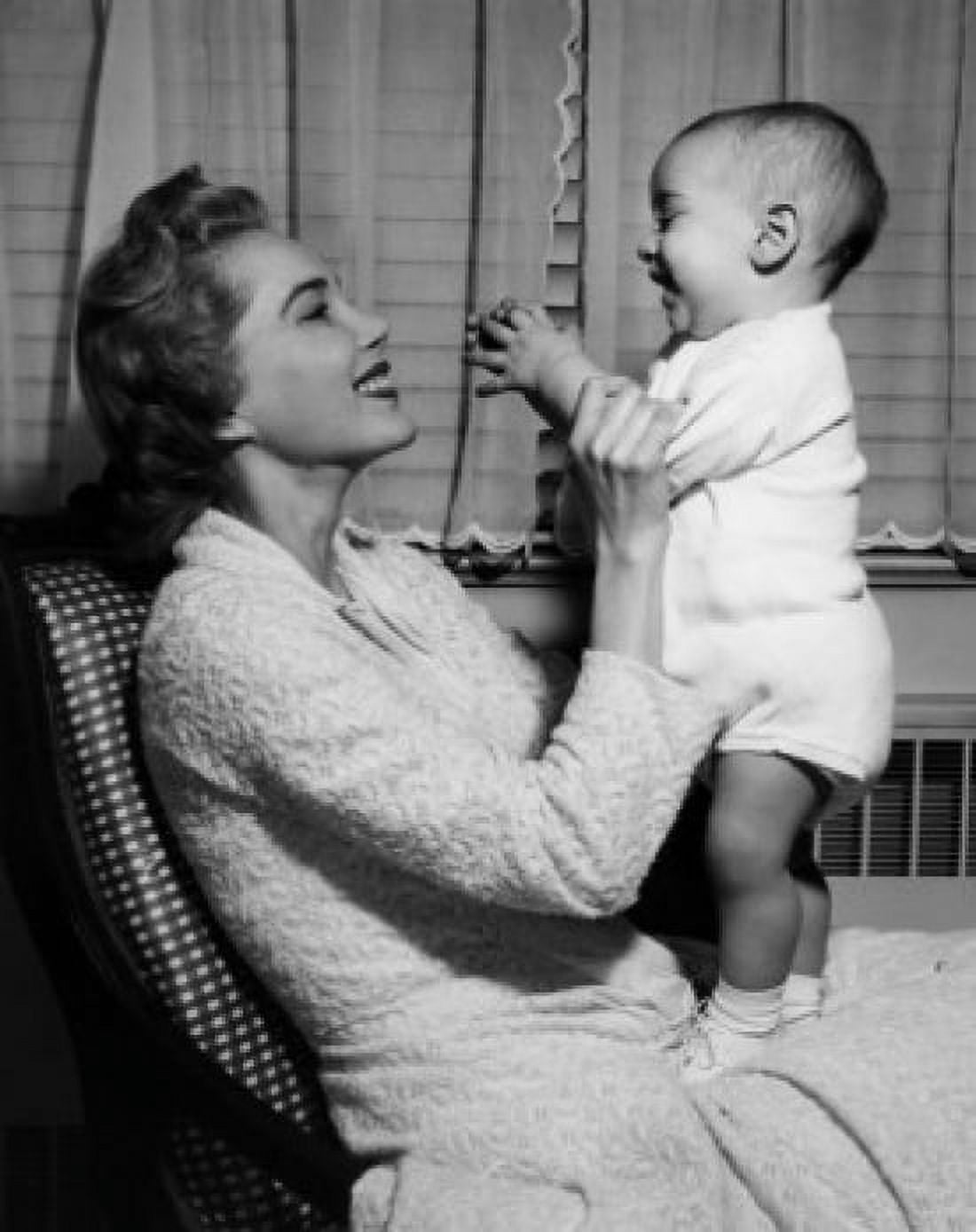 Young woman playing with baby boy Canvas Art - (18 x 24)
