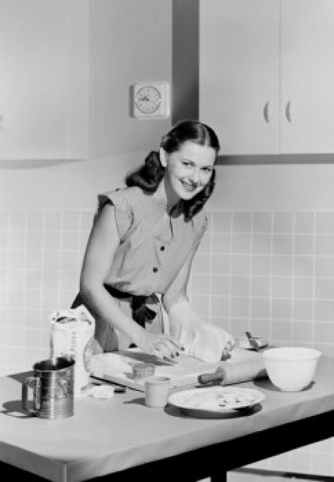Young woman preparing cake in domestic kitchen Canvas Art - (18 x 24)