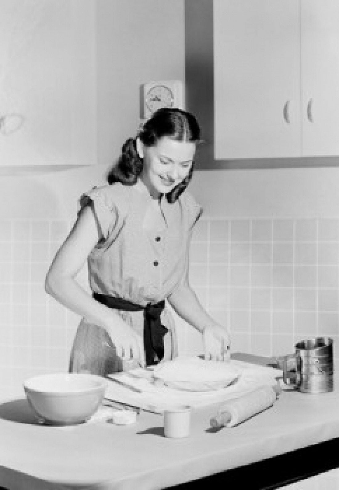 Young woman preparing cake in domestic kitchen Canvas Art - (24 x 36)