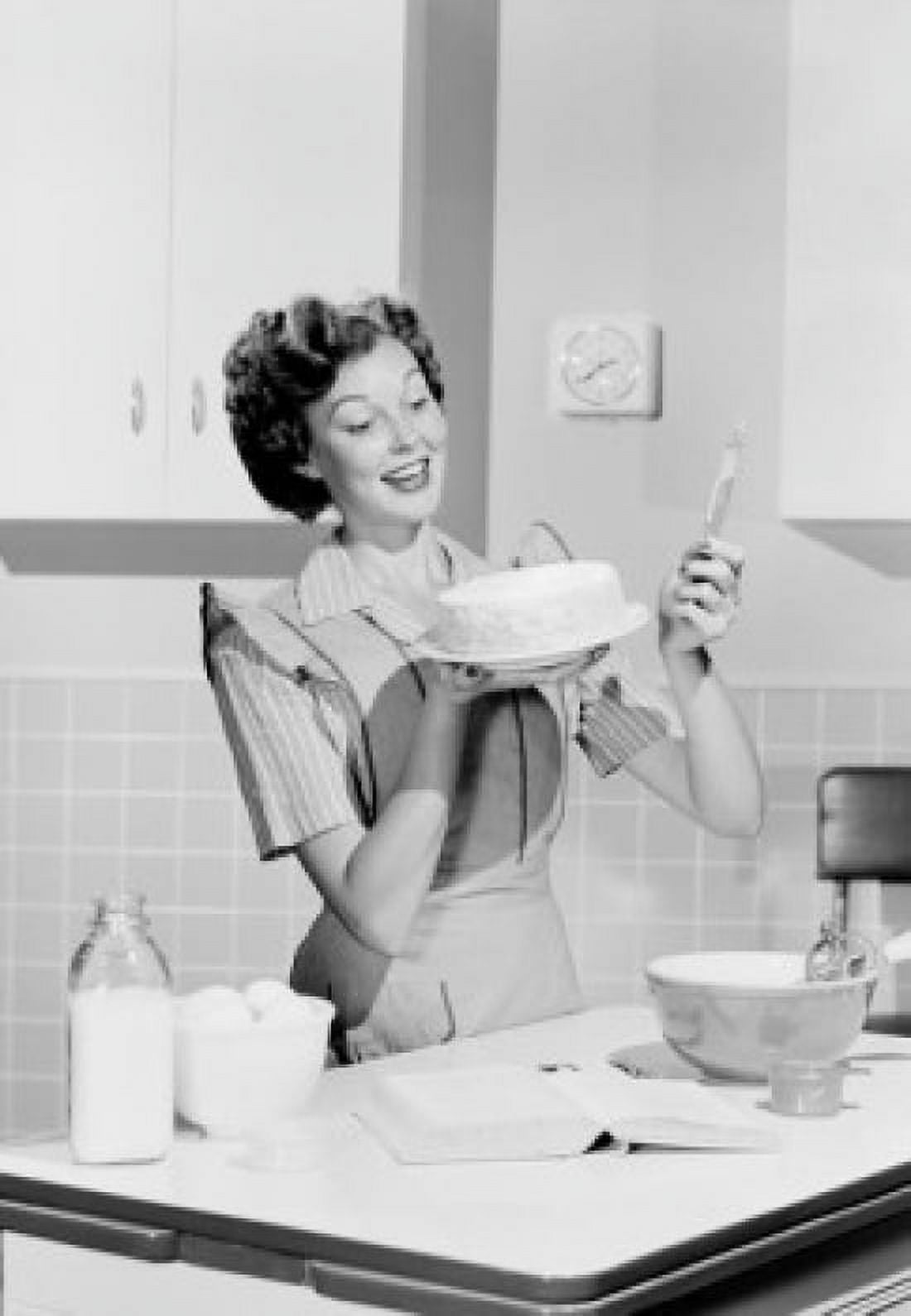 Young woman preparing cake in domestic kitchen Canvas Art - (24 x 36)