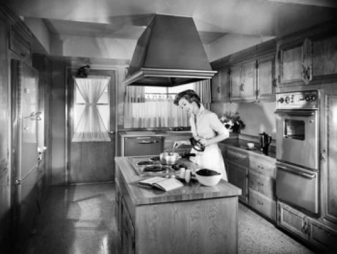 Young woman preparing food in a kitchen Canvas Art - (18 x 24)