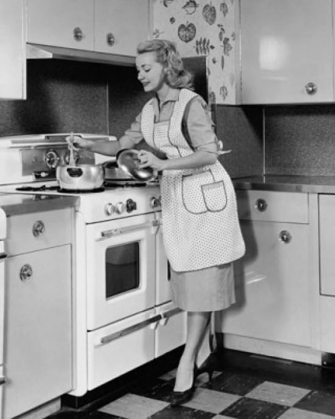 Young woman preparing food in the kitchen Canvas Art - (24 x 36)