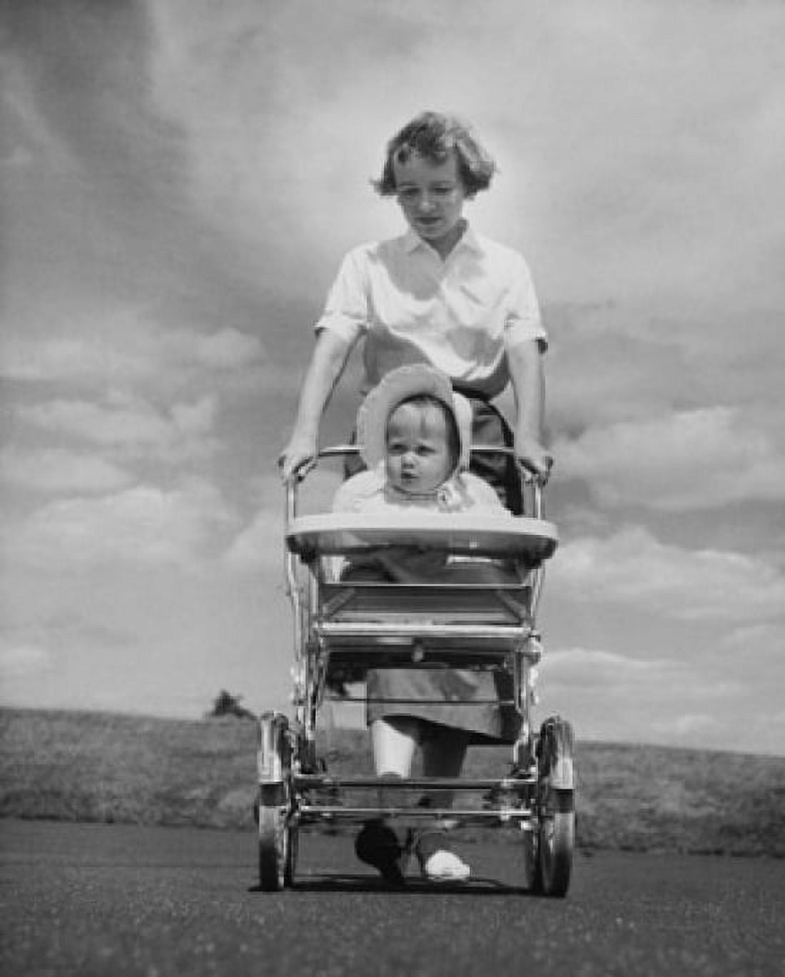 Young woman pushing her baby in a baby stroller Canvas Art - (18 x 24)
