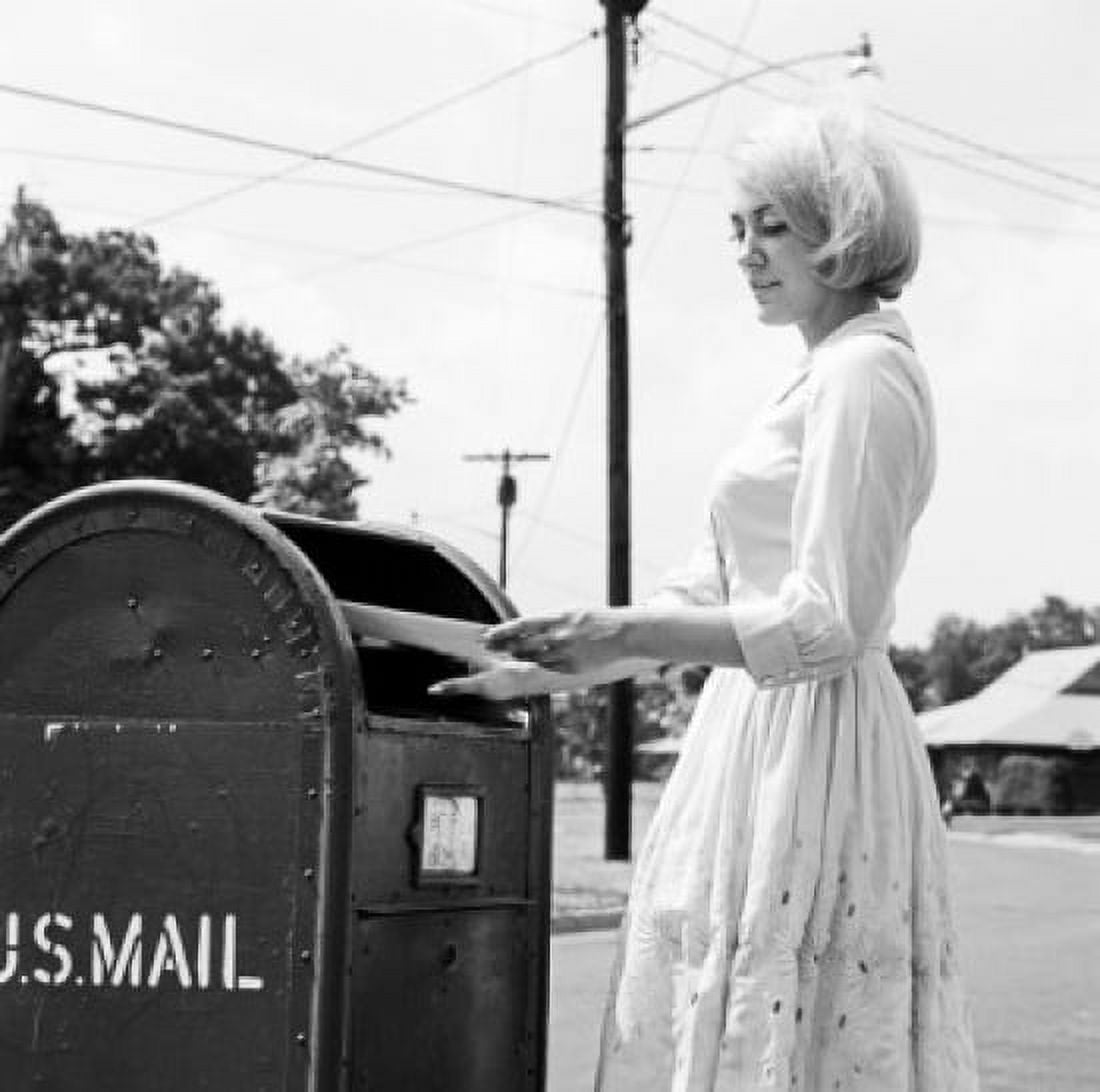 Young woman putting letters in US Mail letter box Canvas Art - (18 x 24)
