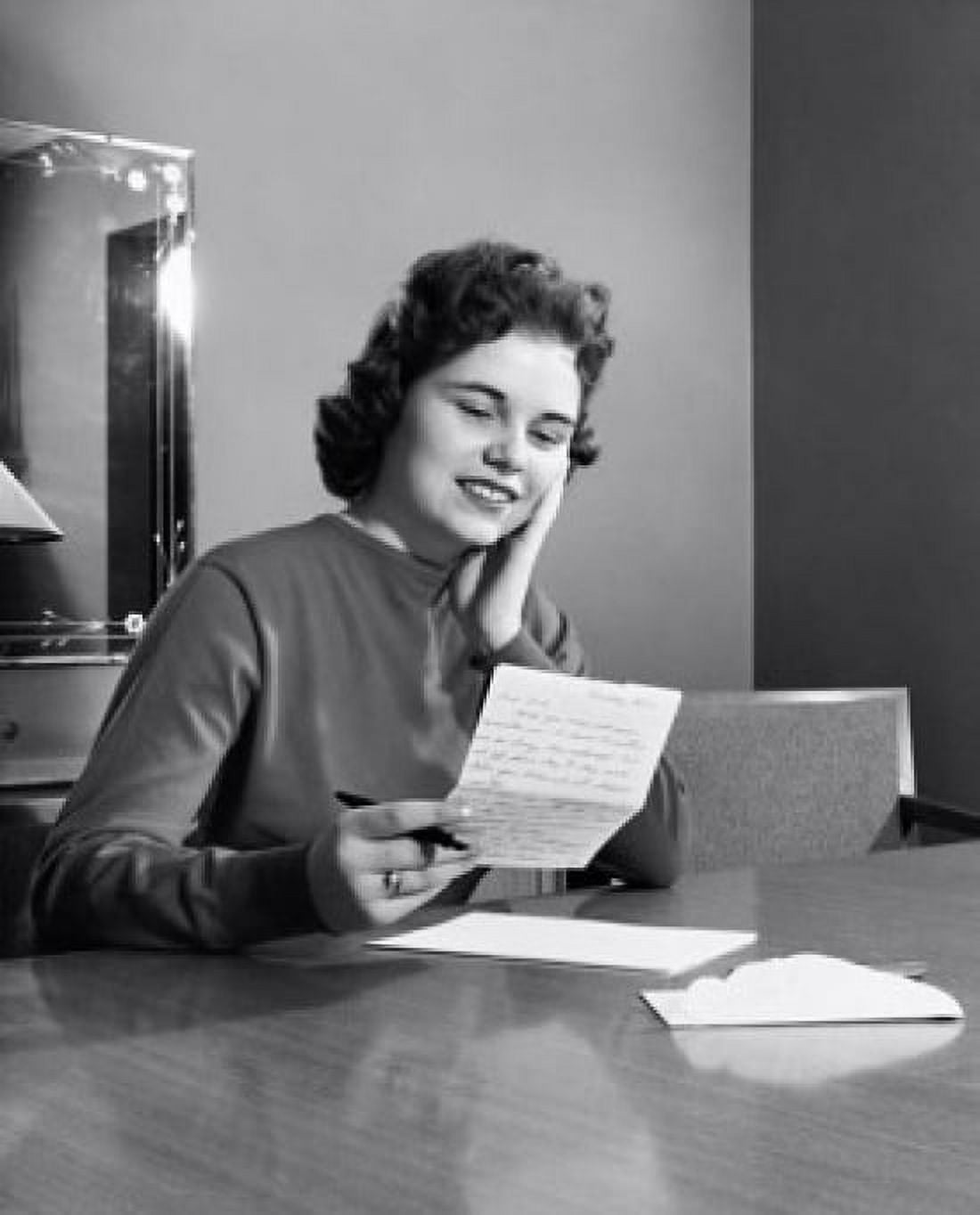 Young woman reading a letter and smiling Canvas Art - (18 x 24)