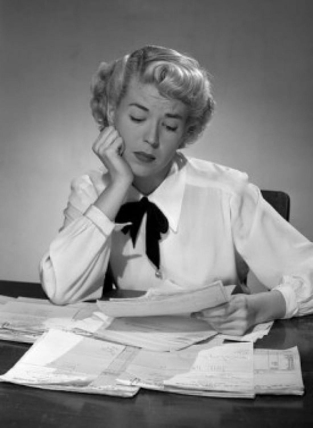 Young woman reading document in office Canvas Art - (24 x 36)