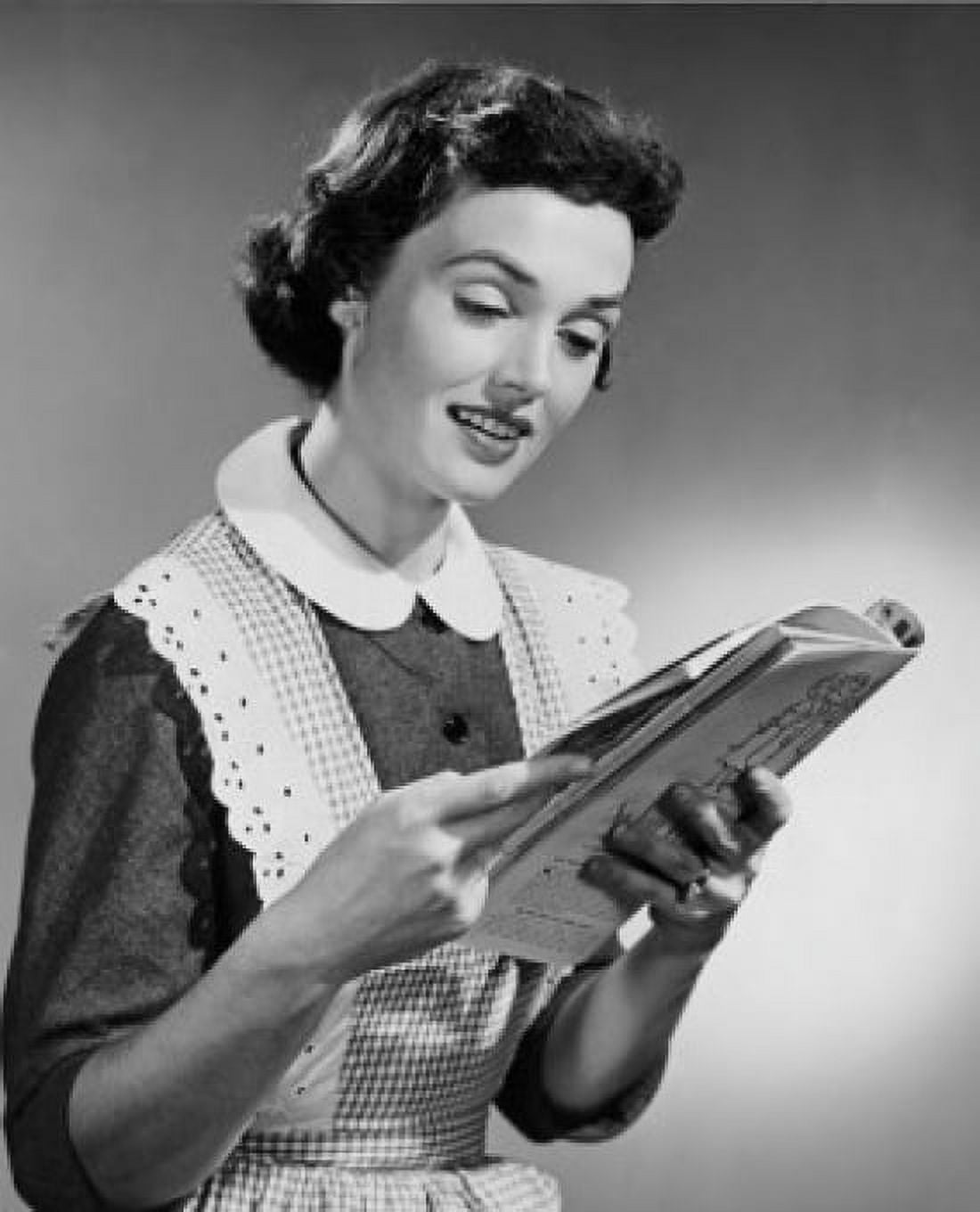 Young woman reading magazine Canvas Art - (24 x 36)
