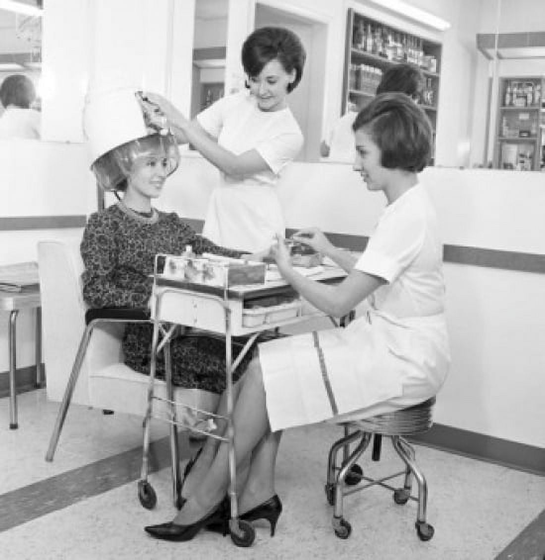 Young woman receiving manicure in hair salon Canvas Art - (24 x 36)