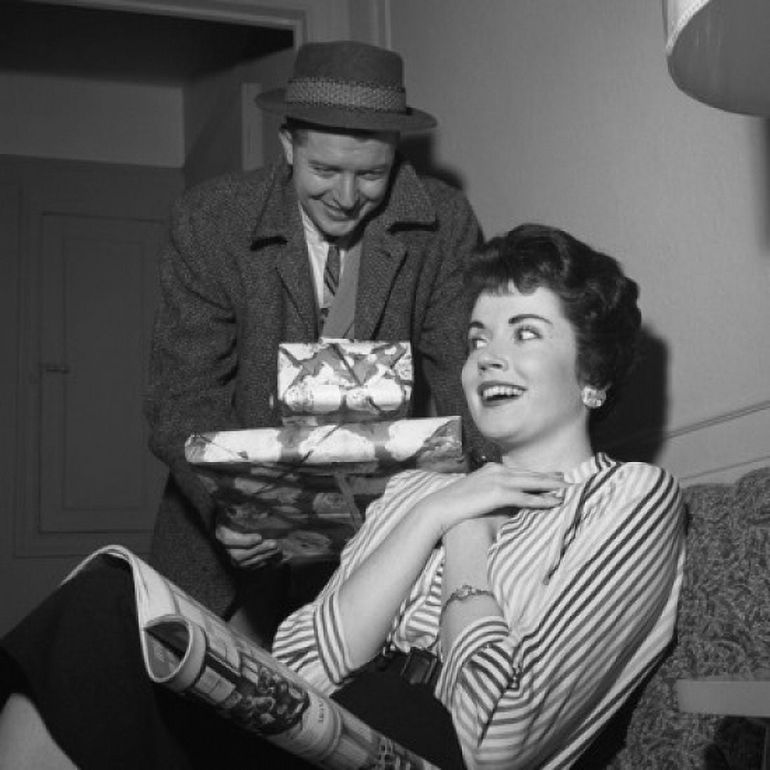 Young woman receiving presents from young man Canvas Art - (18 x 24)