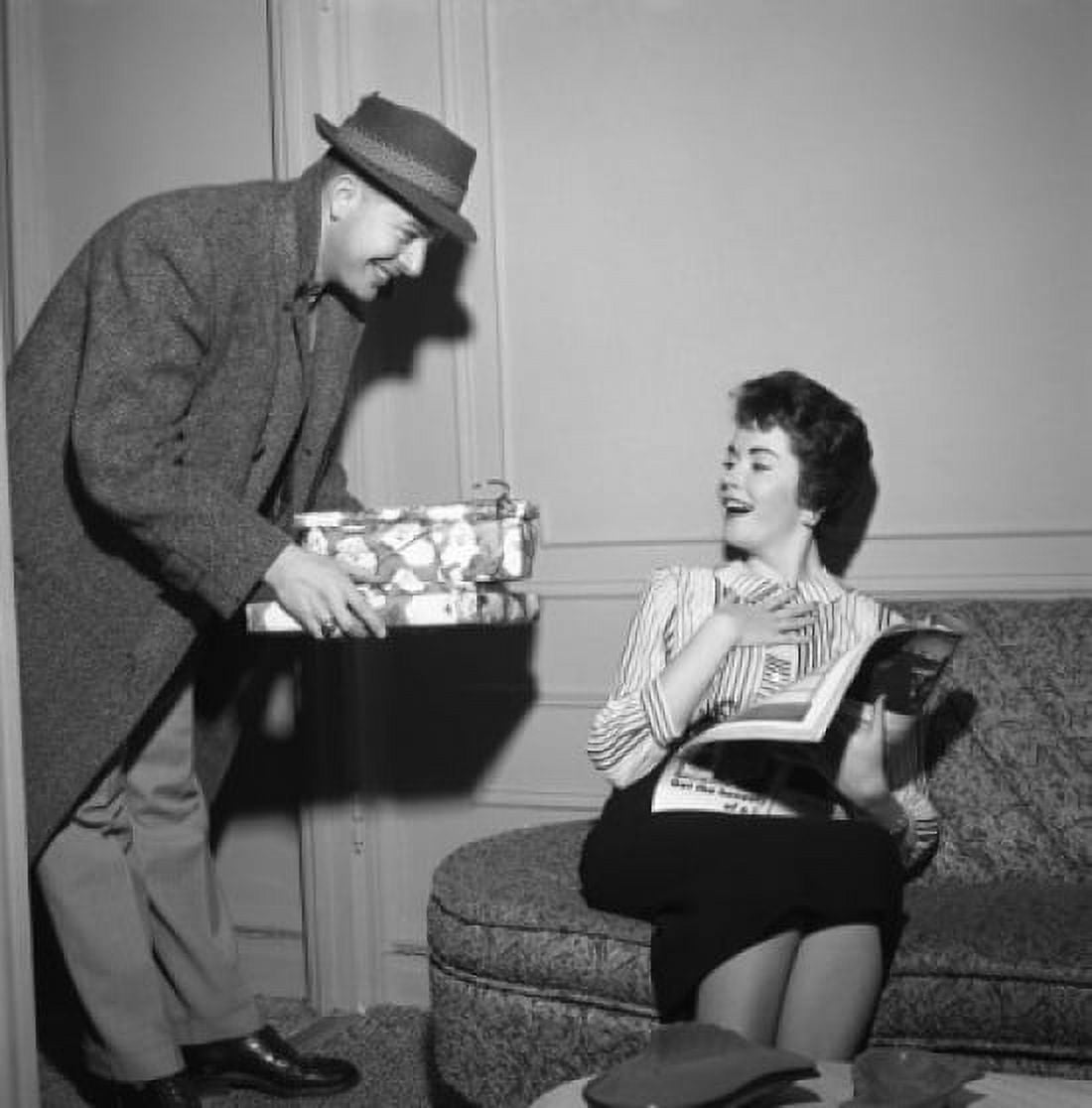 Young woman receiving presents from young man Canvas Art - (24 x 36)