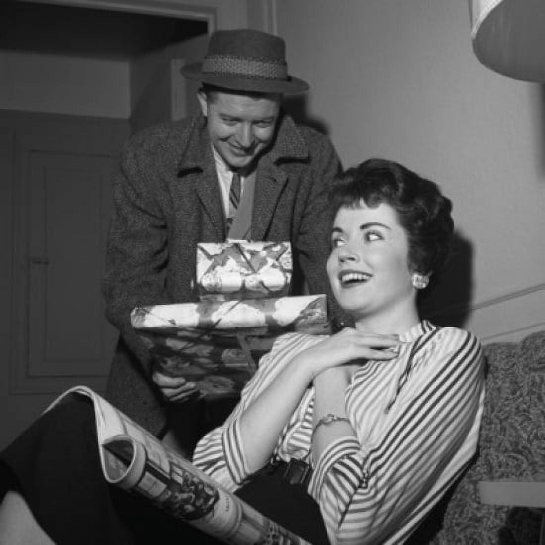 Young woman receiving presents from young man Canvas Art - (24 x 36)