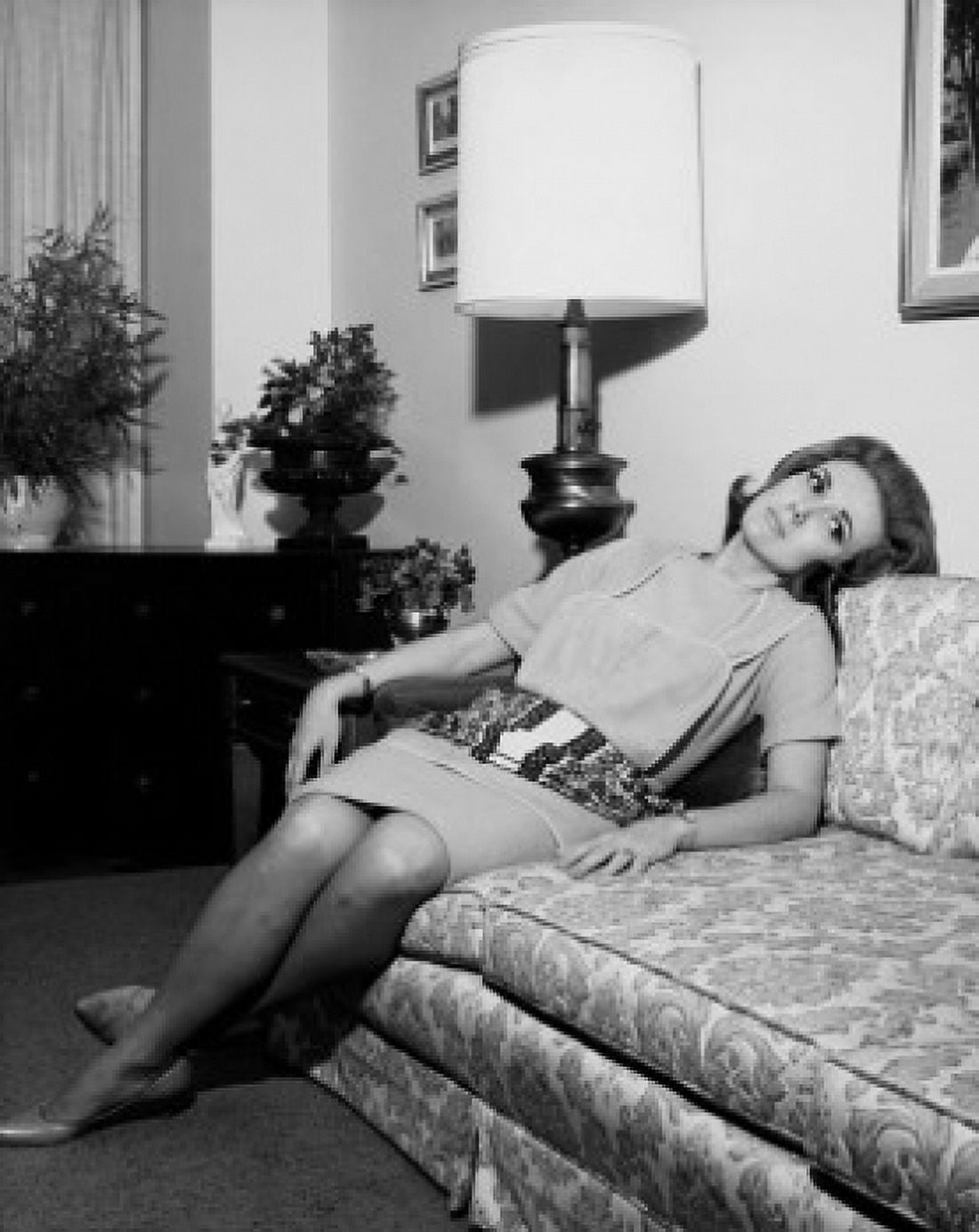 Young woman reclining on a couch Canvas Art - (18 x 24)