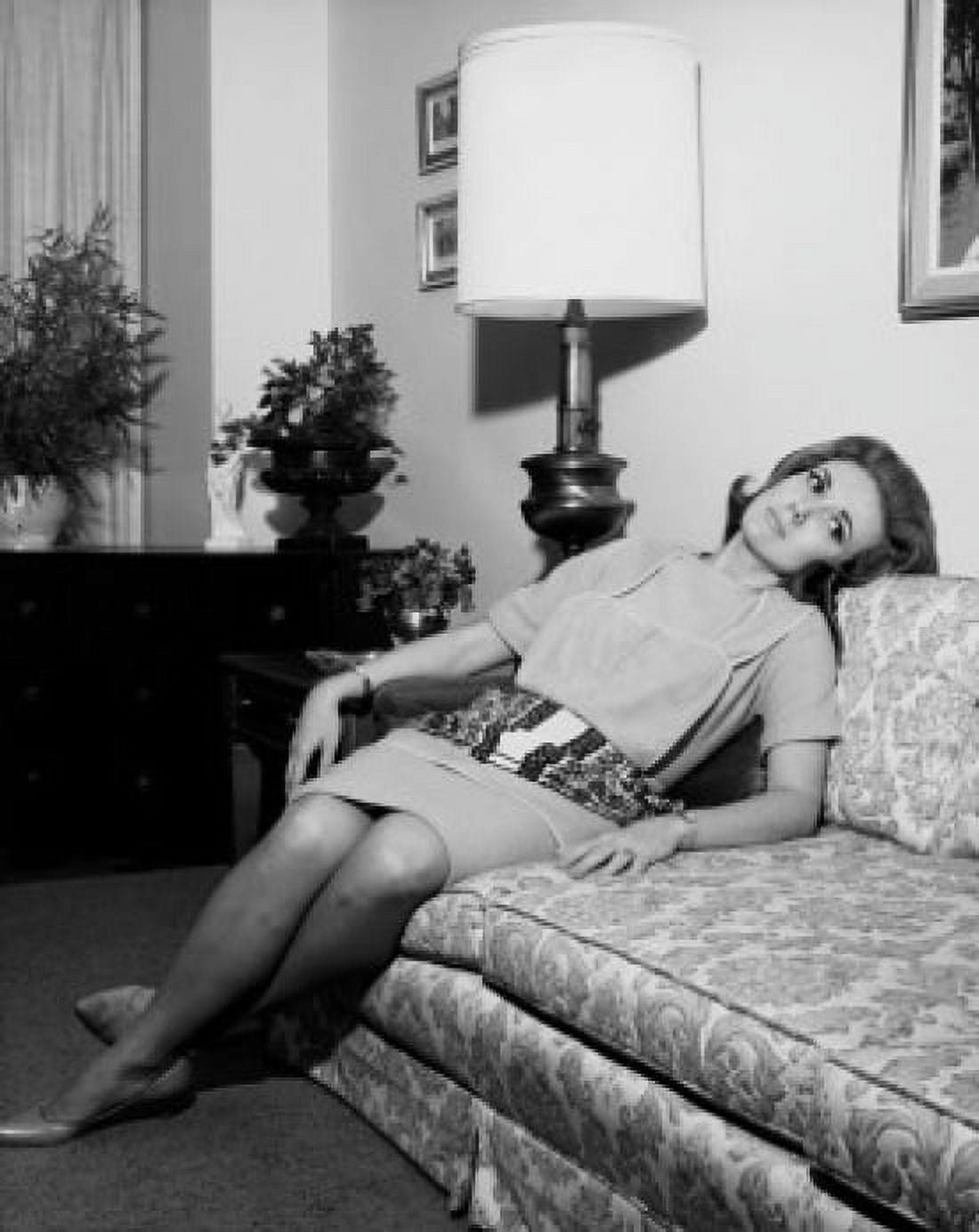 Young woman reclining on a couch Canvas Art - (24 x 36)