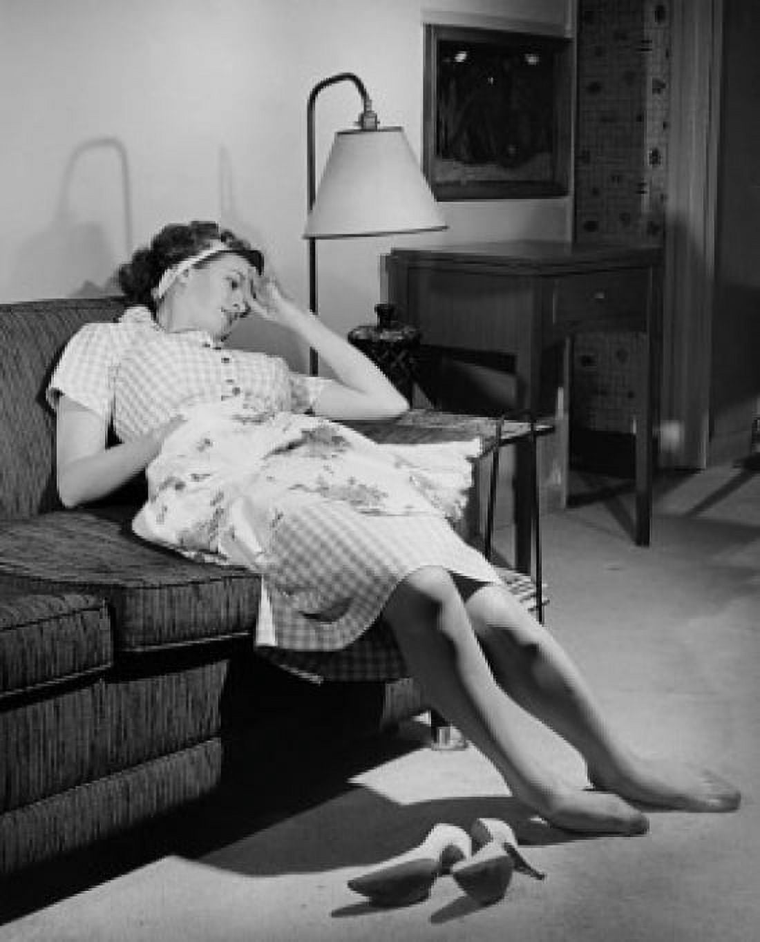 Young woman resting on a couch Canvas Art - (18 x 24)