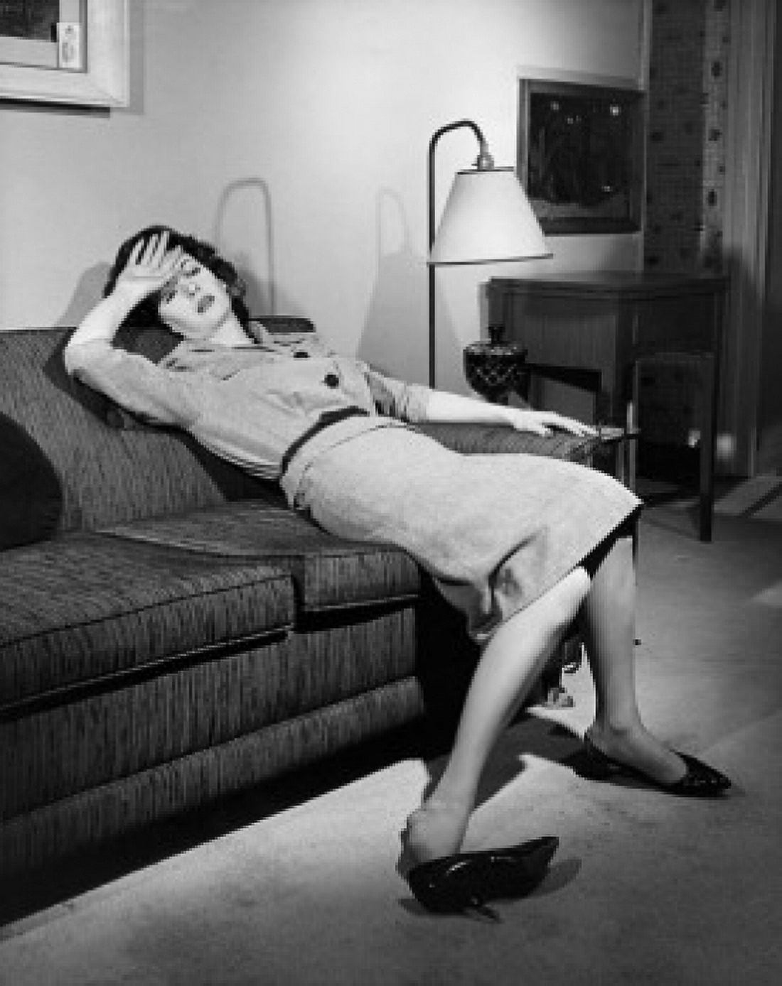 Young woman resting on a couch Canvas Art - (24 x 36)