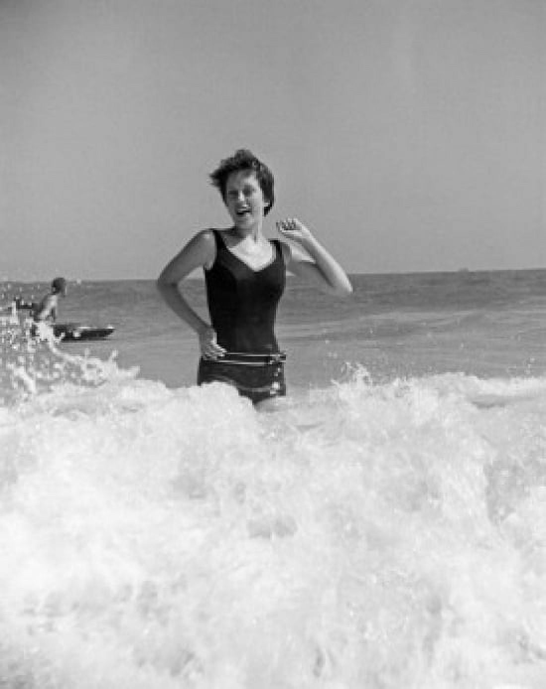 Young woman running in surf Canvas Art - (18 x 24)