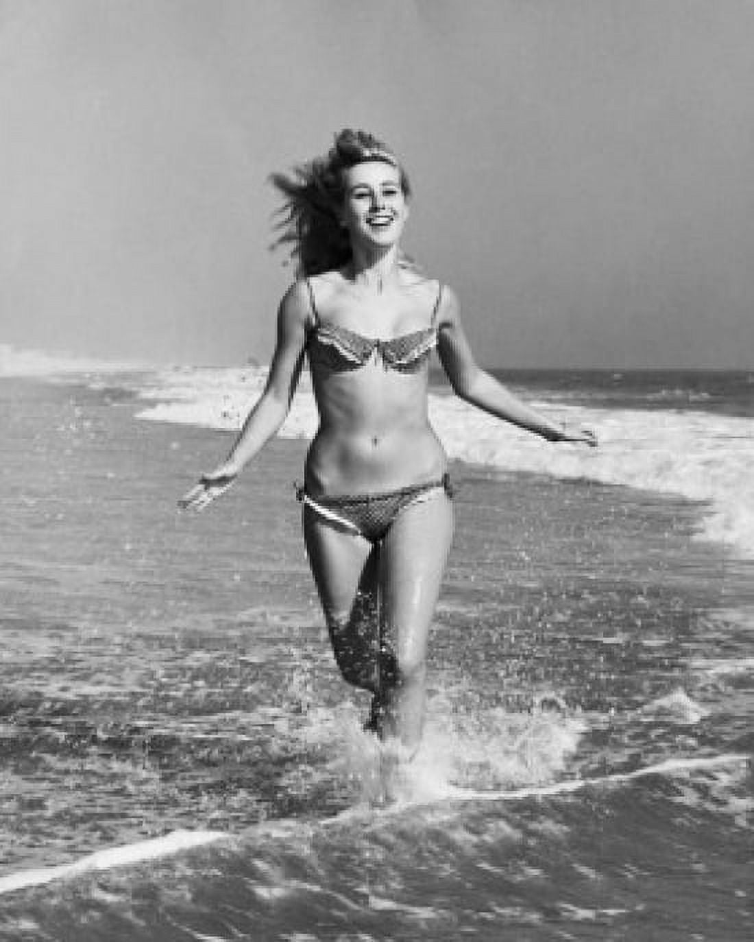 Young woman running on beach Canvas Art - (24 x 36)
