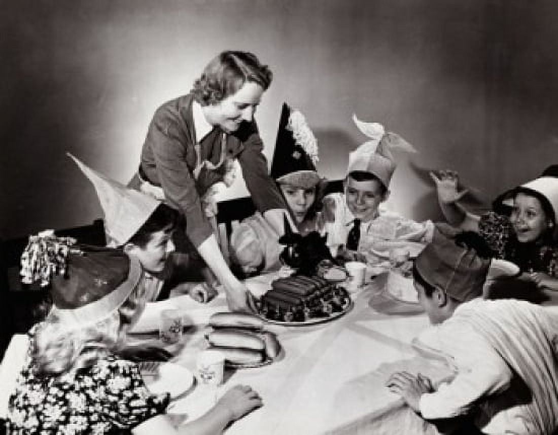 Young woman serving hot dogs to children at a party Canvas Art - (24 x 36)