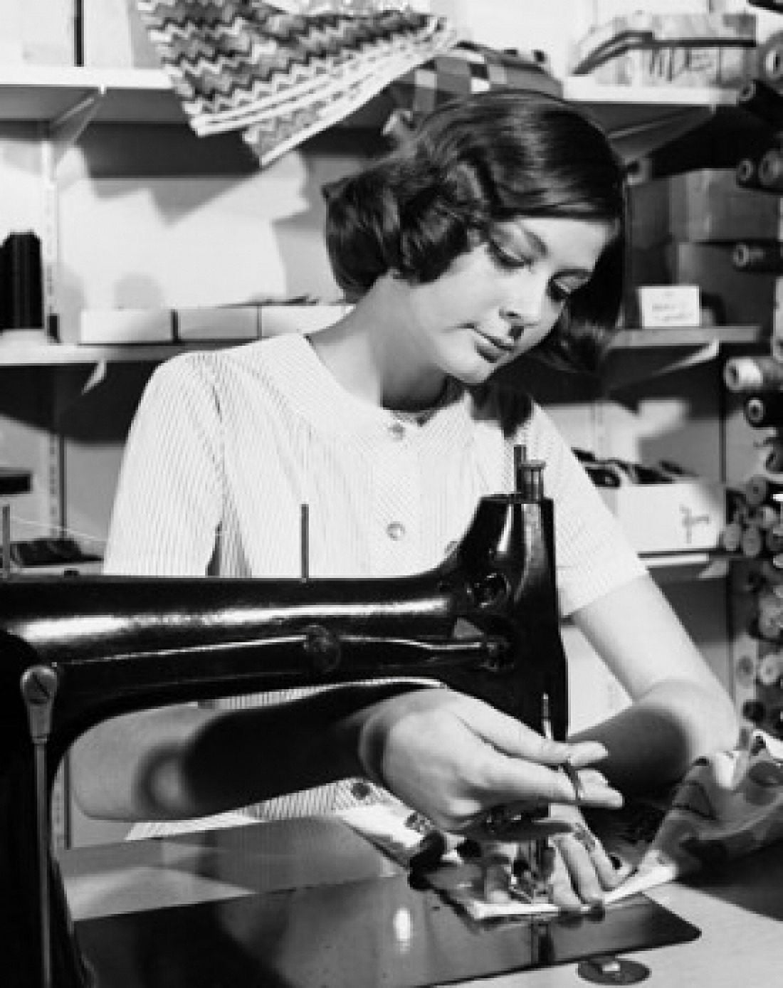 Young woman sewing clothes Canvas Art - (24 x 36)