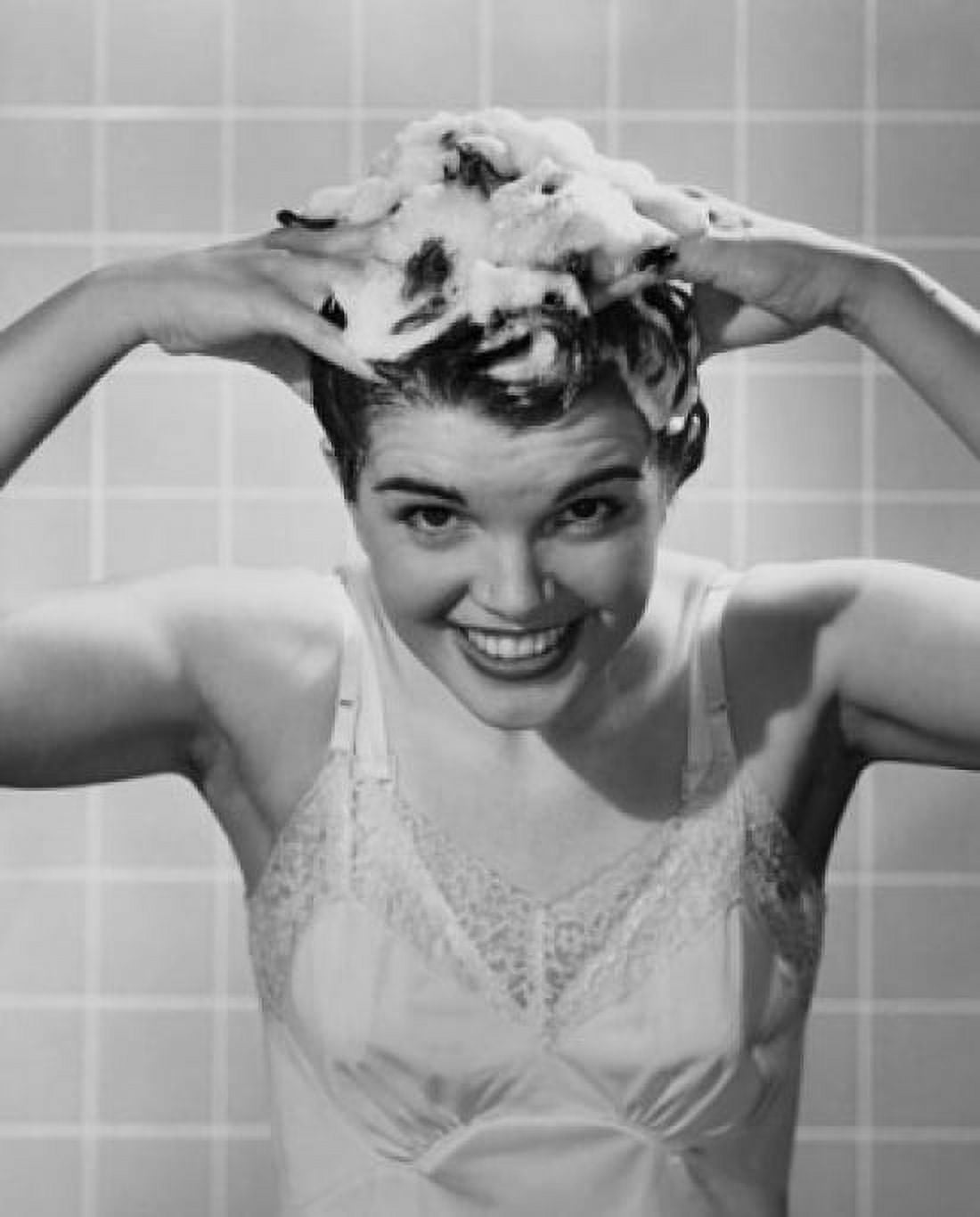 Young woman shampooing her hair Canvas Art - (18 x 24)