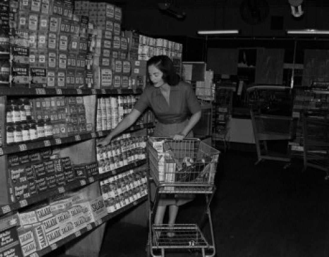 Young woman shopping in supermarket Canvas Art - (18 x 24)