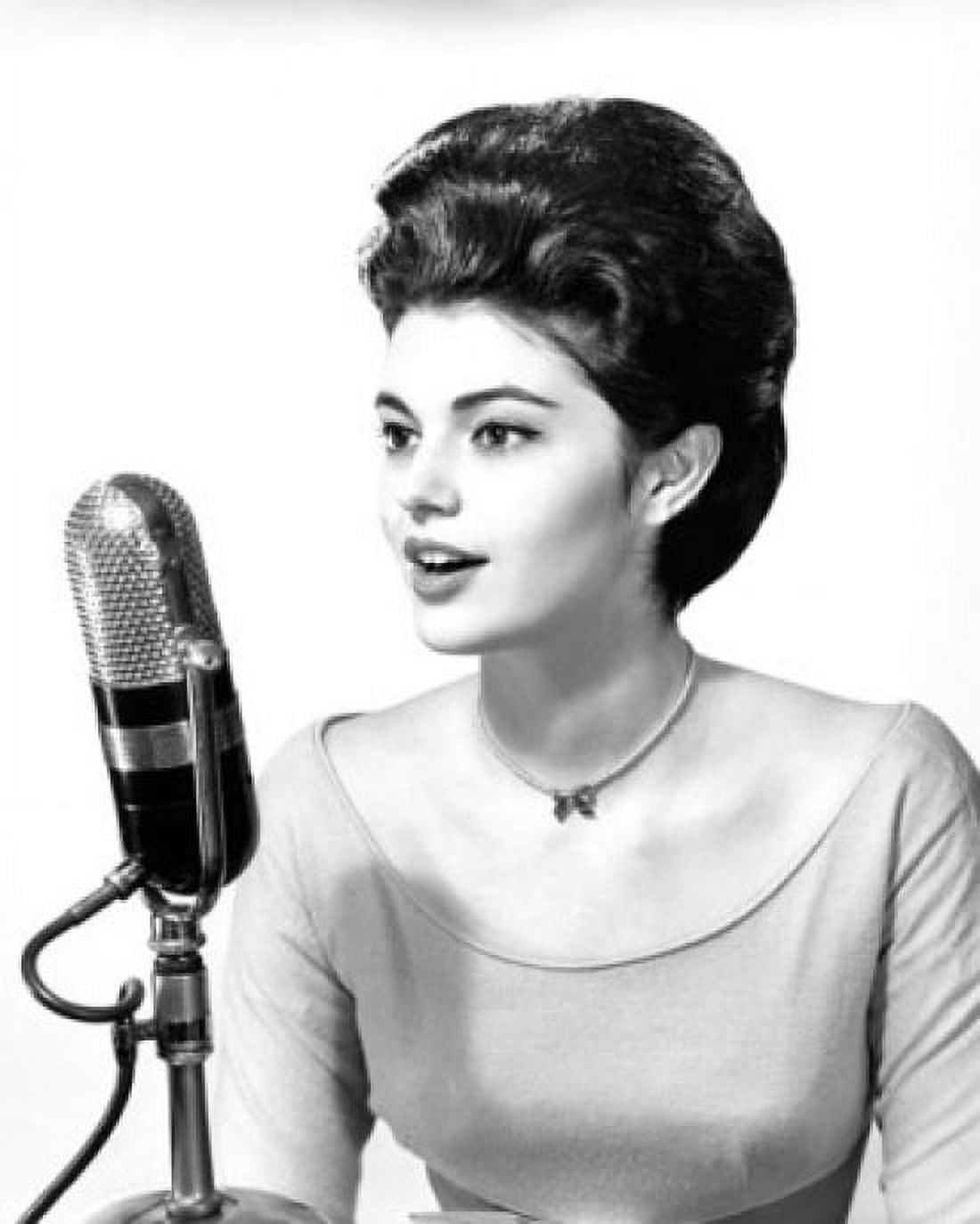 Young woman singing into a microphone Canvas Art - (24 x 36)
