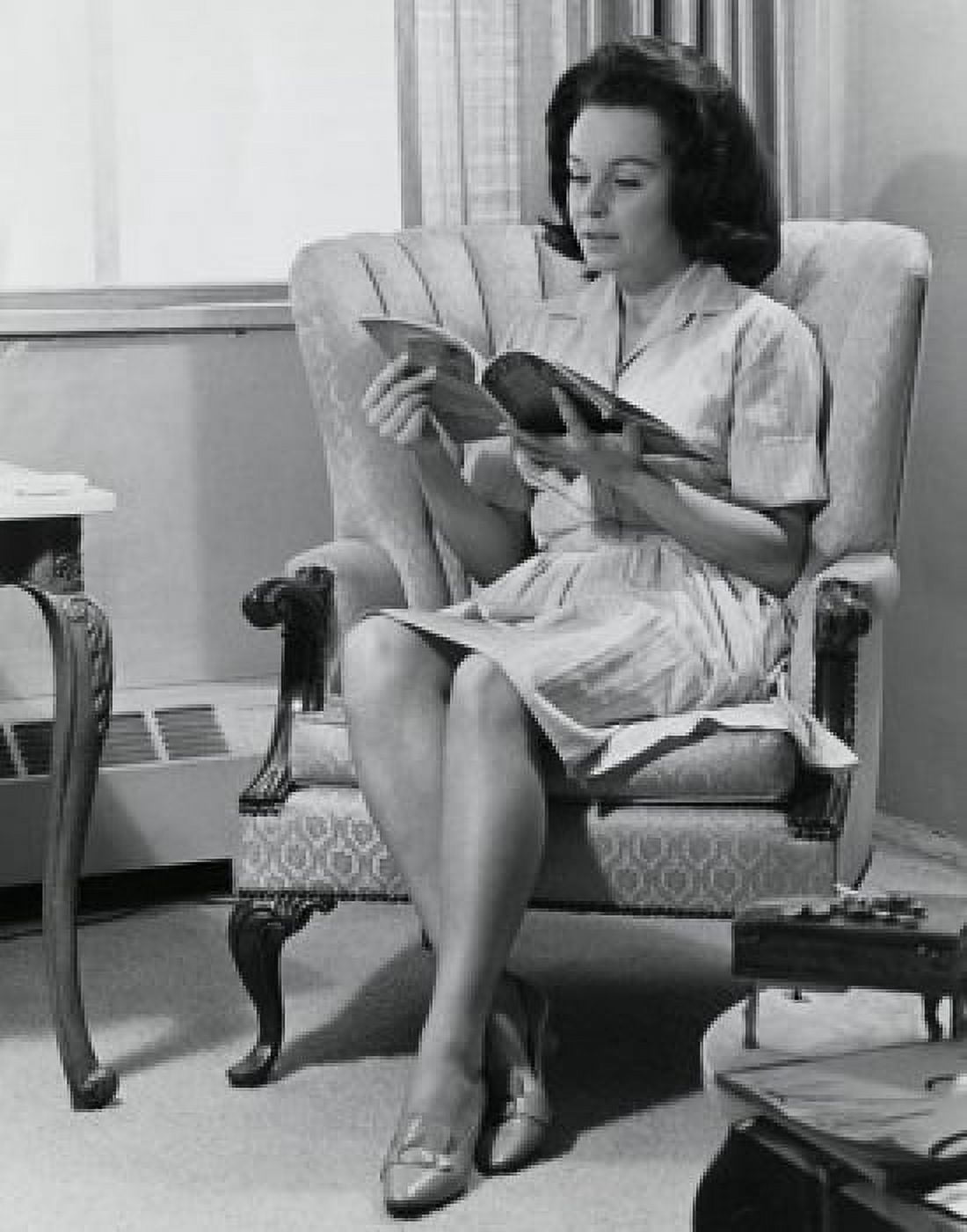 Young woman sitting on an armchair reading a magazine Canvas Art -  (18 x 24)