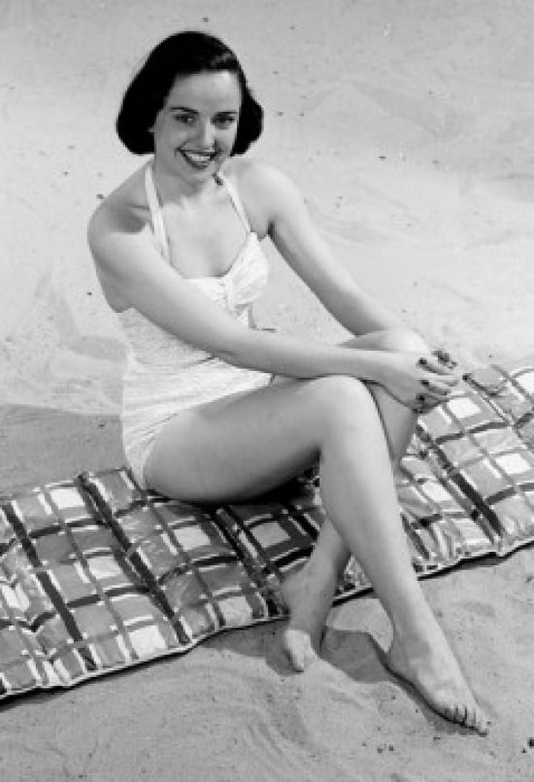Young woman sitting on beach Canvas Art - (18 x 24)
