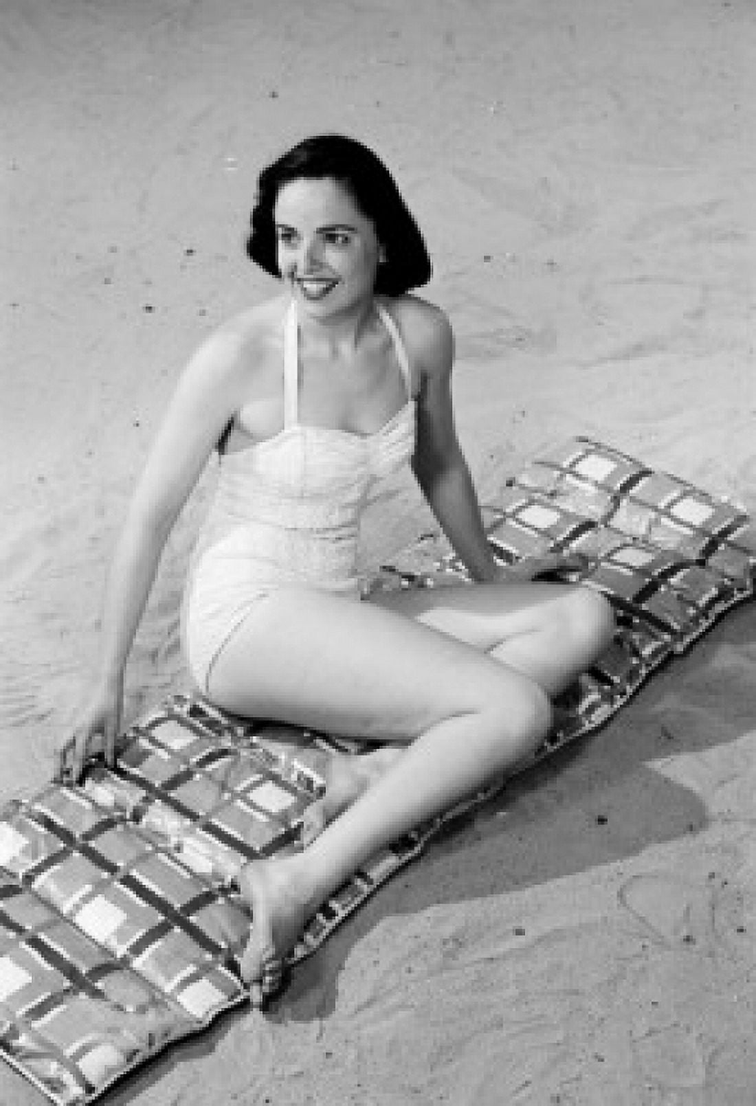 Young woman sitting on beach Canvas Art - (24 x 36)