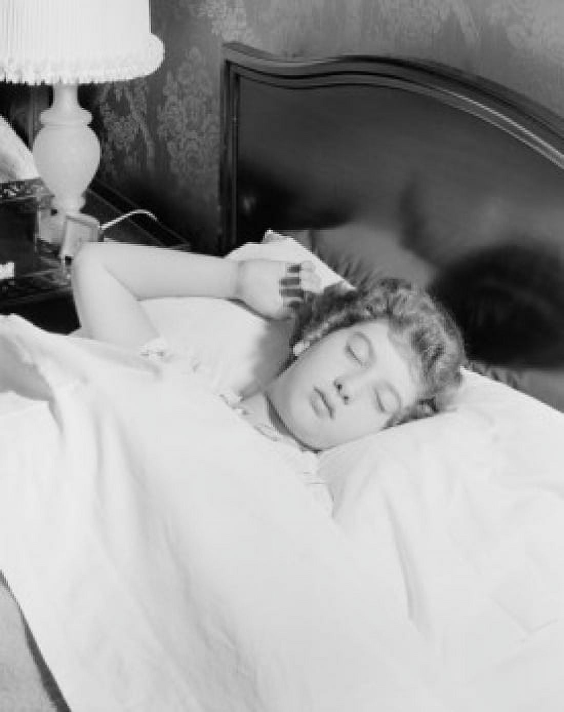 Young woman sleeping in bed Canvas Art - (24 x 36)