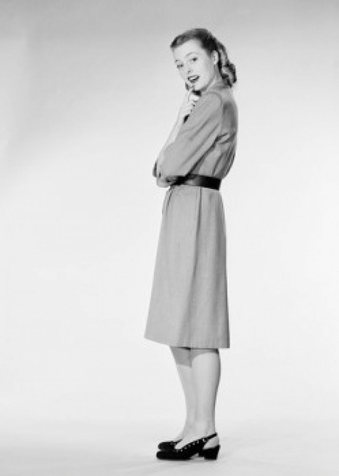 Young woman standing and looking at camera studio shot Canvas Art - (24 x 36)