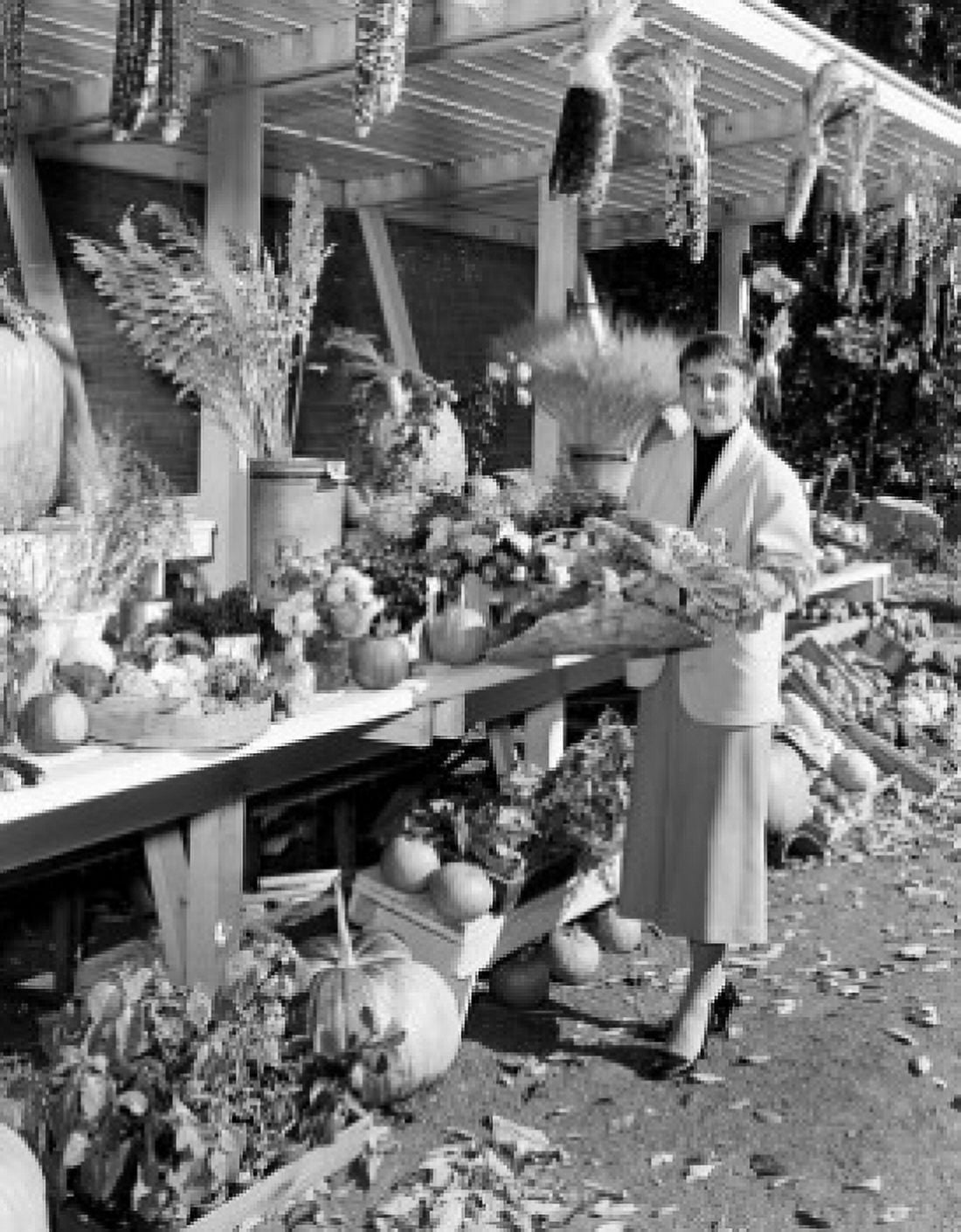 Young woman standing in front market stalls in farmers market Canvas Art - (18 x 24)