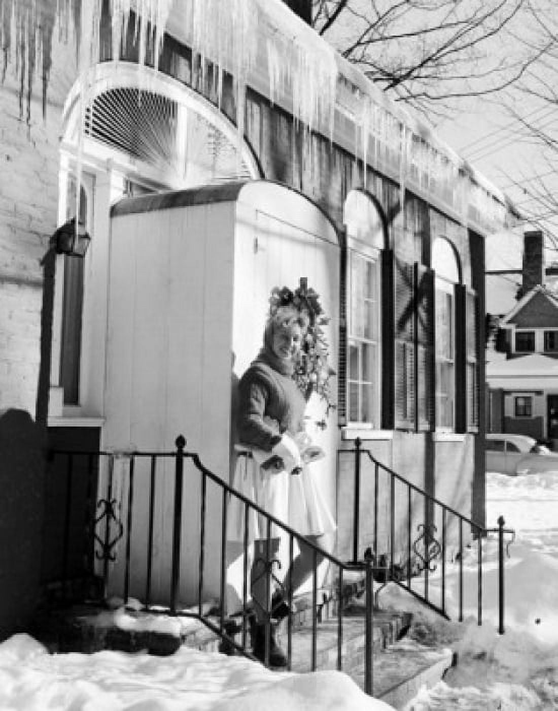 Young woman standing in front of house entrance Canvas Art - (18 x 24)