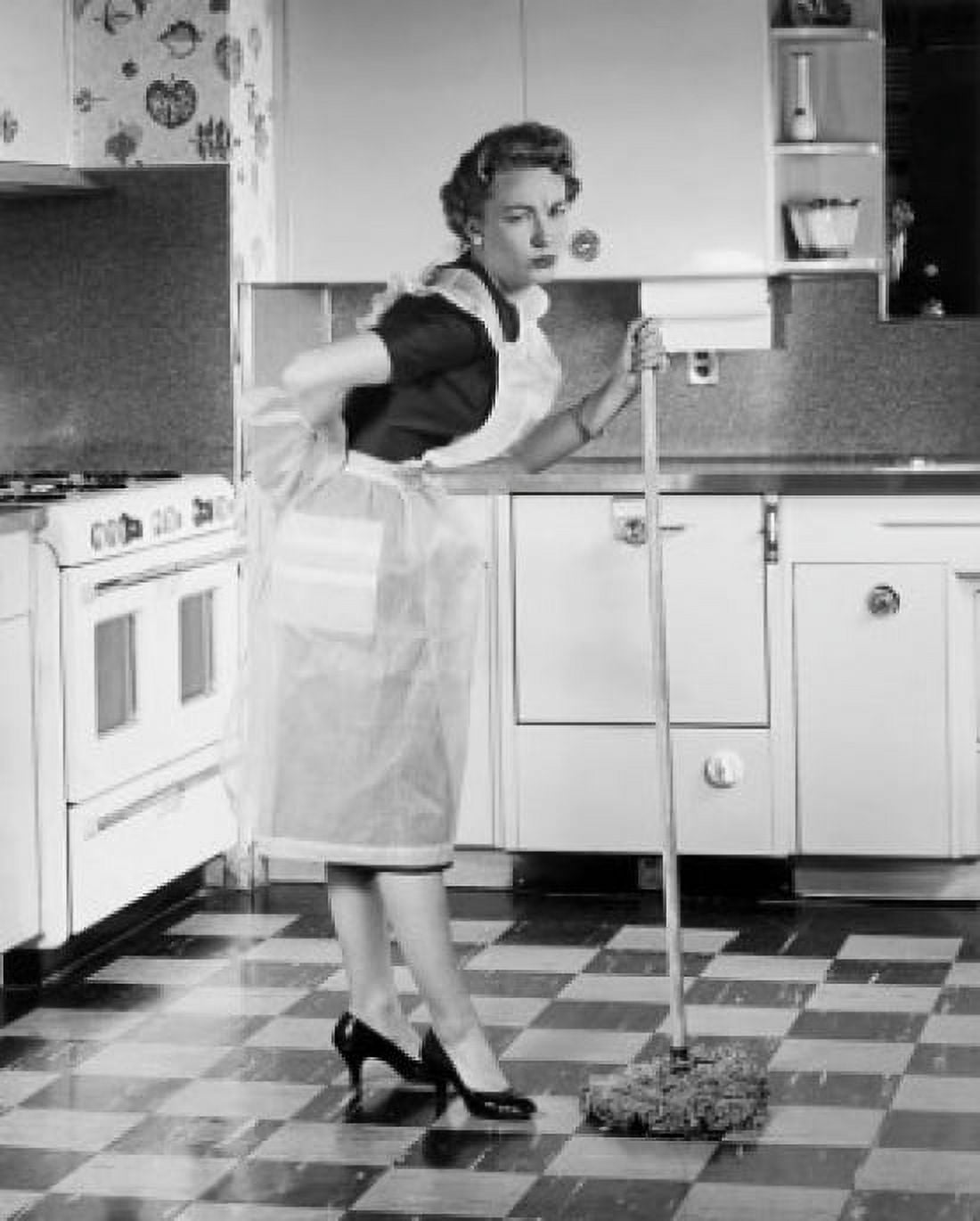 Young woman standing in kitchen holding mop Canvas Art - (18 x 24)